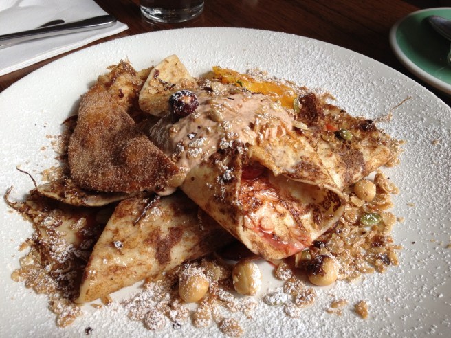 Baked rhubarb and strawberries rolled in French toast tortillas with orange, mint and granola