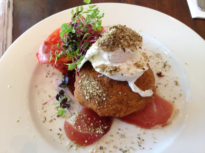 Dukkah Eggs - chickpea pattie, prosciutto, poached eggs, house-dried tomatoes, labna and pepita seed dukkah - Red Robyn, Camberwell