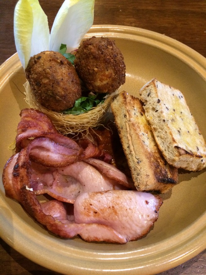 Walnut spiced crumbed eggs, kataifi nest, kasundi, fresh herbs pickled cauliflower, house cured bacon and buttered fried soldiers - White Rabbit, Brighton