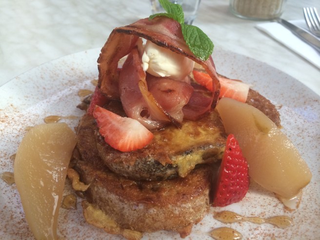 French Toast with cinnamon poached pears, crispy bacon and maple syrup - The Meeting Place Cafe, South Yarra