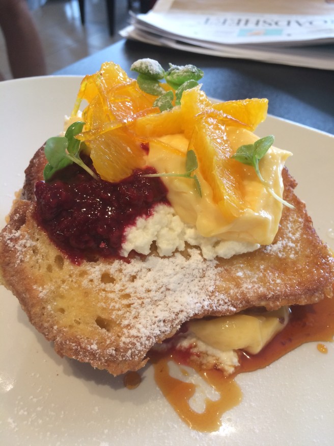 Brioche French Toast "St Clements" with lemon curd, fresh orange, ricotta, candied zest, raspberry compote, baby basil and burnt orange syrup - Lolo and Wren, Brunswick West